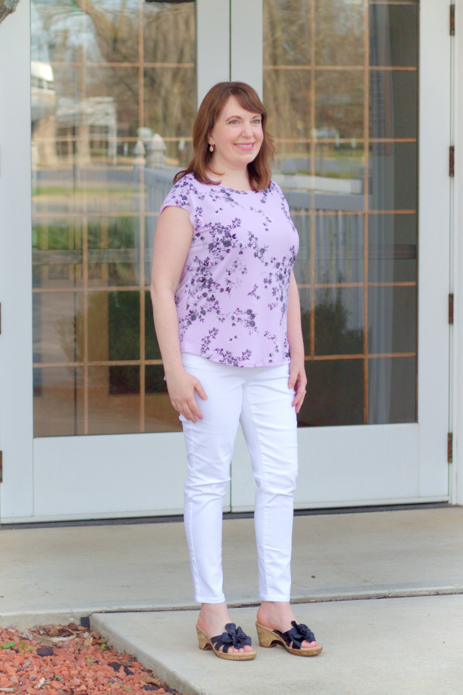 Dianna Miller Wearing A Printed Top & White Jeans From Kohl's