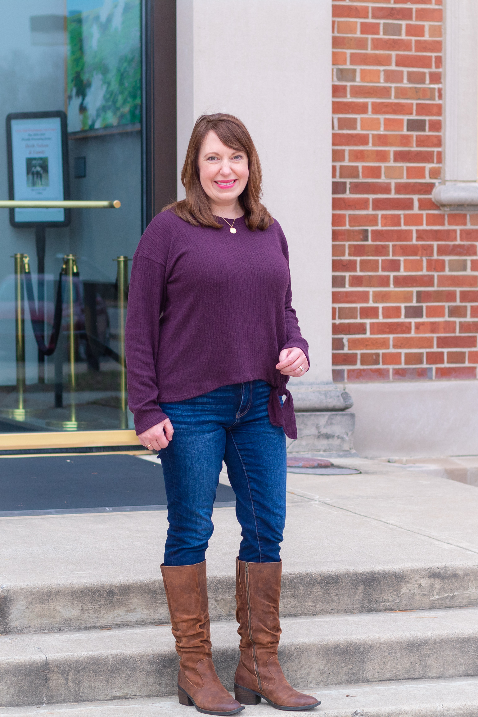 Dianna Wearing a Purple Sweater, Jeans, & Brown Boots